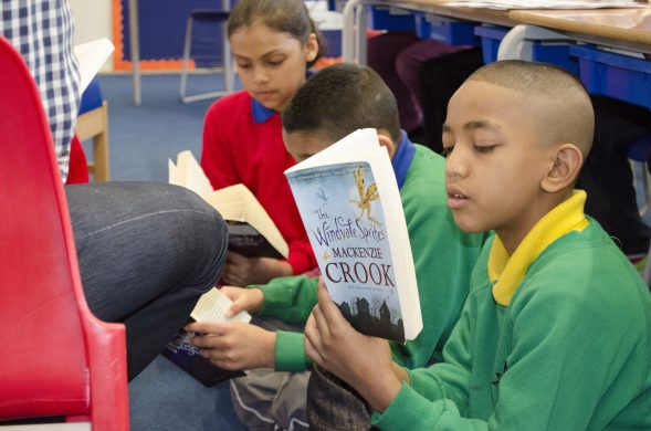 primary pupils reading books