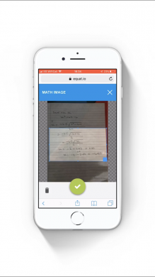 Picture of a phone with the EquatIO mobile app taking a photo of handwritten maths on a page