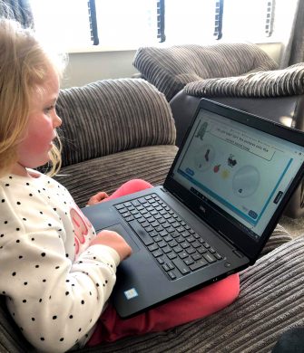 A young child playing an interactive phonics game on Classroom Secrets Kids