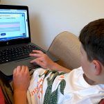 A child using an interactive grammar activity on Classroom Secrets Kids