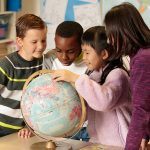 School children around a globe