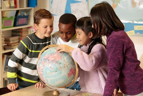 School children around a globe